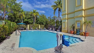 Outdoor pool, open 6:00 AM to 7:00 PM, pool umbrellas