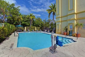 Outdoor pool, open 6:00 AM to 7:00 PM, pool umbrellas