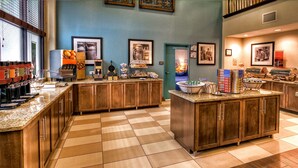 A spacious kitchen with a checkered floor, wooden cabinets, and various appliances.