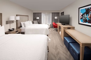 Premium bedding, desk, laptop workspace, blackout drapes