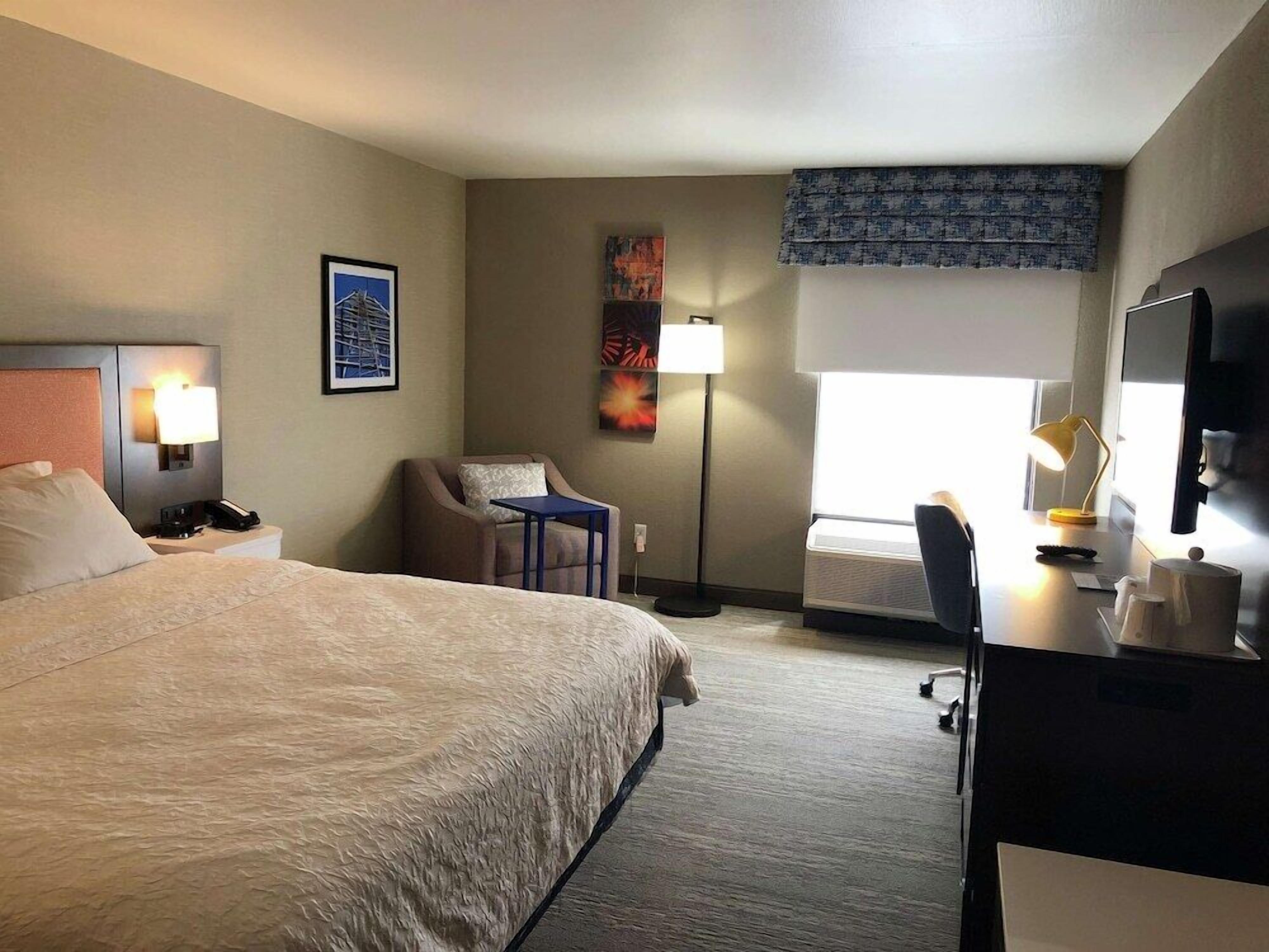 Desk, laptop workspace, blackout curtains, iron/ironing board