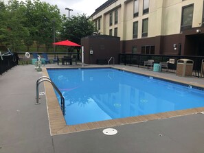 Seasonal outdoor pool, open 9 AM to 10 PM, pool umbrellas