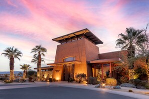 A modern building with a unique architectural design, featuring a prominent tower and a large entrance. - Hilton Grand Vacations Club Palm Desert (Palm Desert)