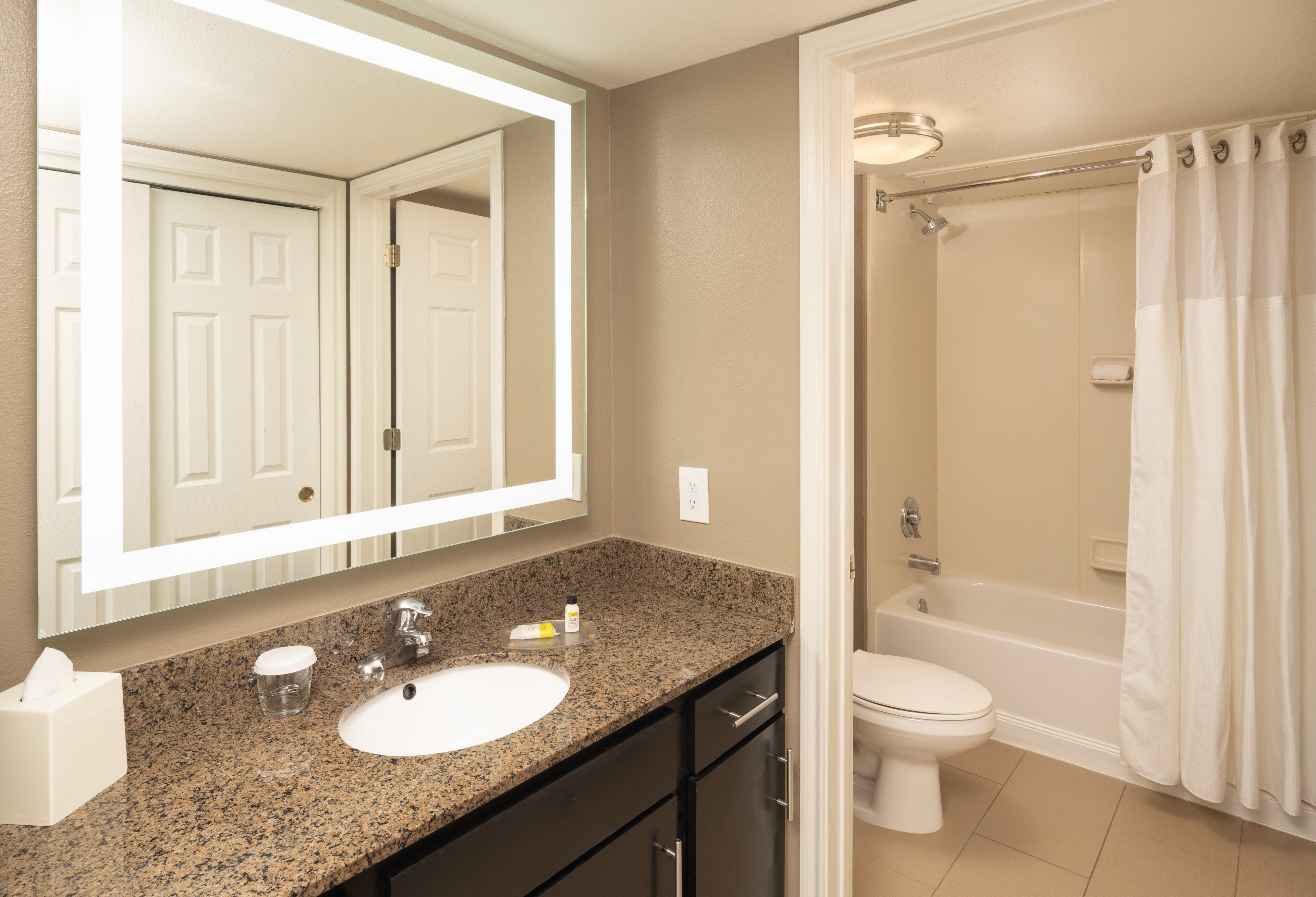 suite, 1 bedroom, kitchen (1 king bed) | bathroom | combined shower/bathtub, free toiletries, hair dryer, towels