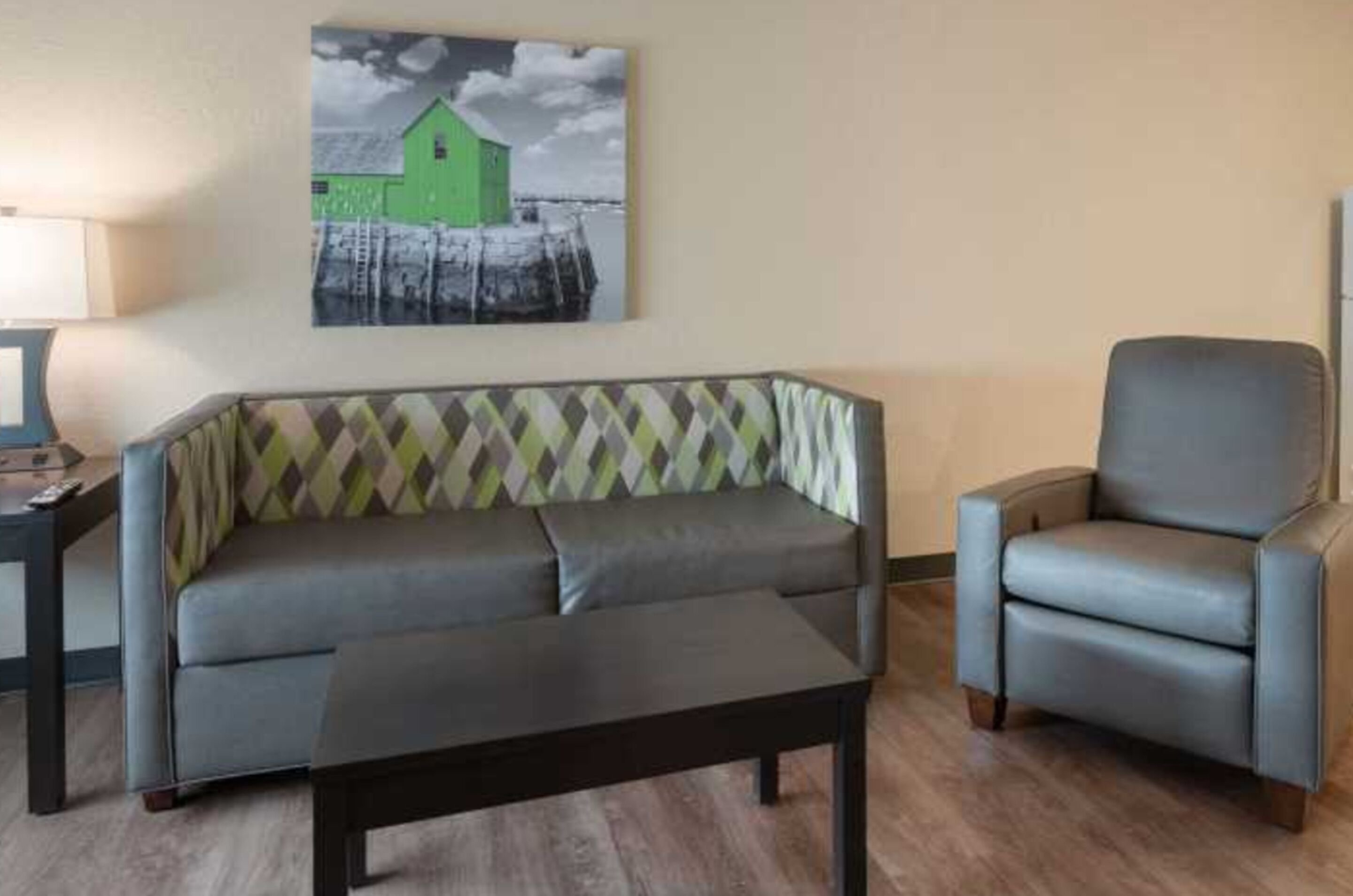 deluxe studio, 1 queen bed with sofa bed, accessible, non smoking | living room | 32-inch flat-screen tv with cable channels, tv