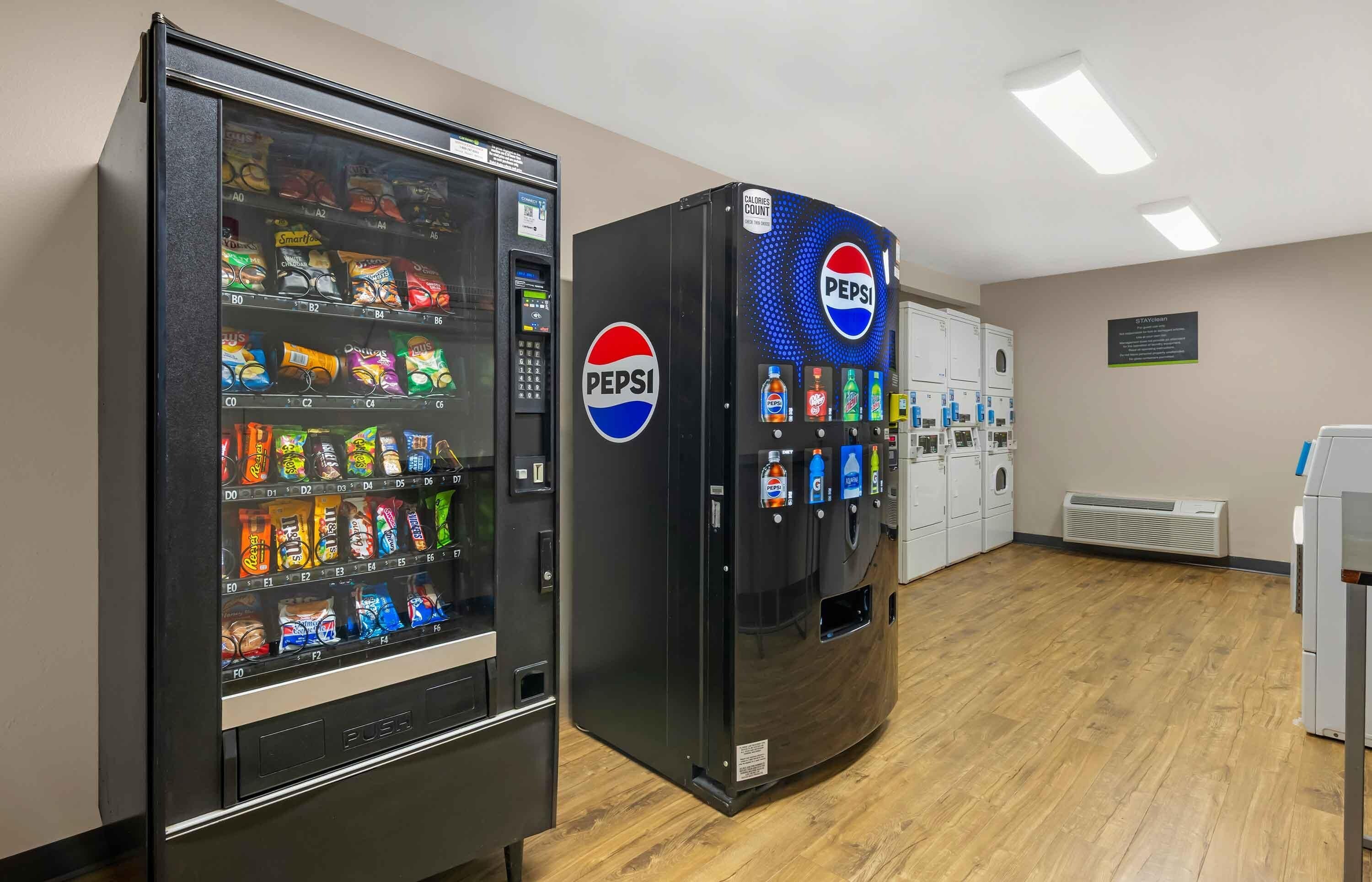 A vending machine area with snacks and a Pepsi machine.