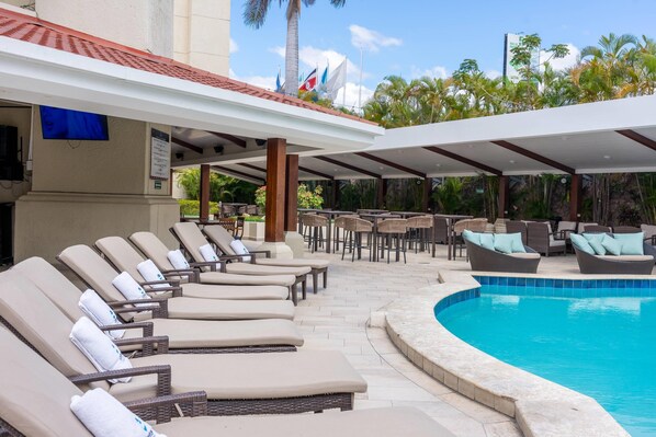 Outdoor pool, open 9:00 AM to 8:00 PM, free cabanas, pool umbrellas
