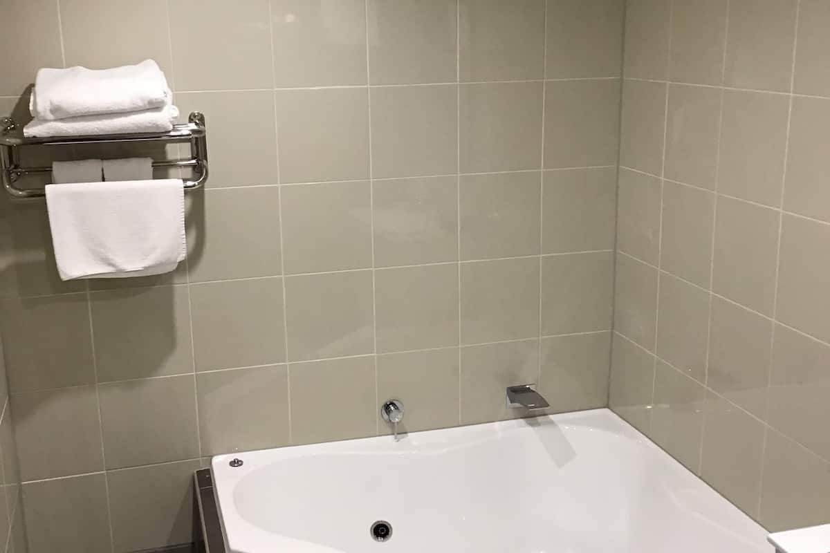 queen spa room | bathroom | shower, designer toiletries, hair dryer, towels