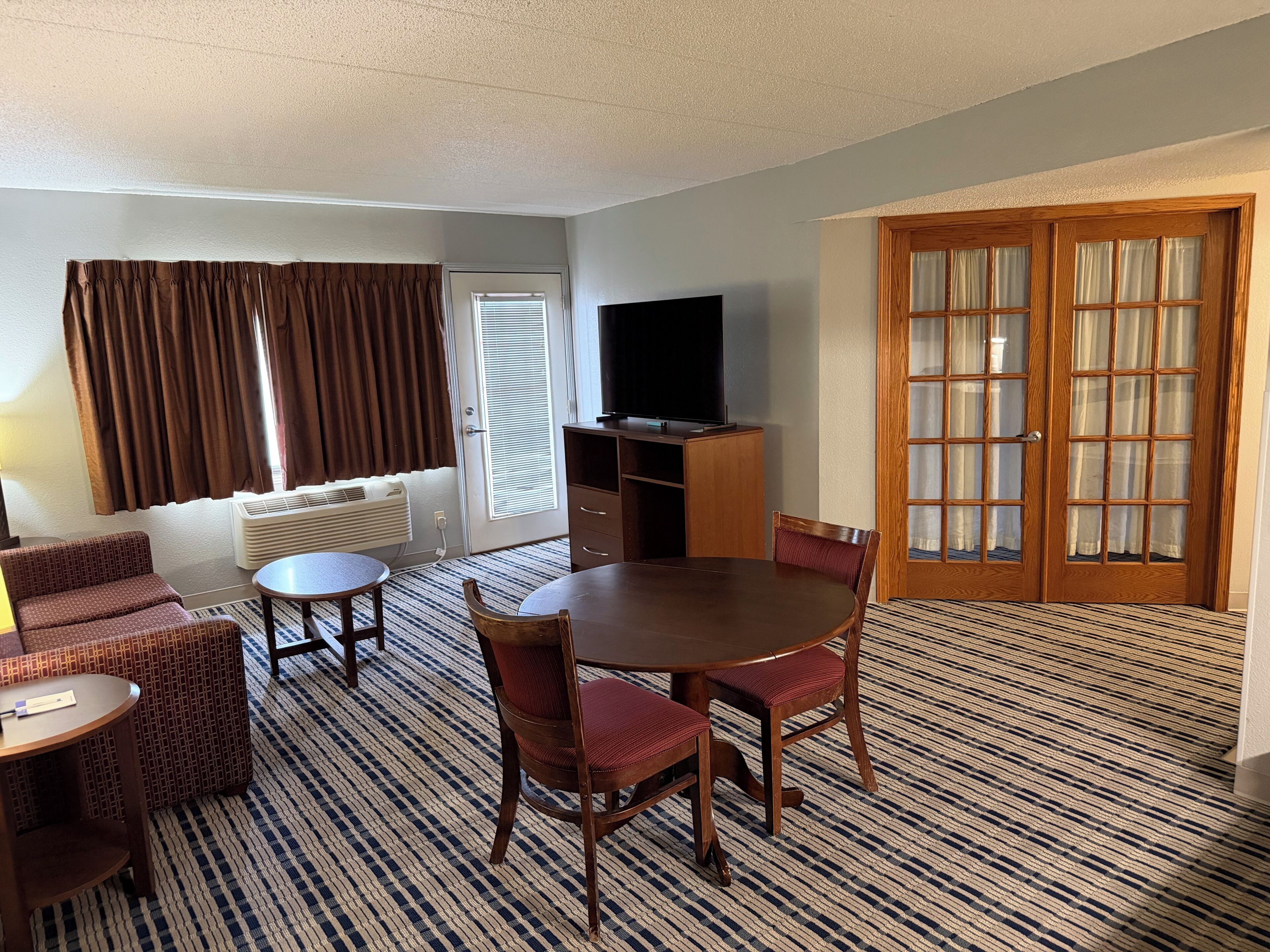 Suite, 1 King Bed, Non Smoking (One-Bedroom Suite) | Living area | 55-inch LCD TV with cable channels, TV, MP3 dock