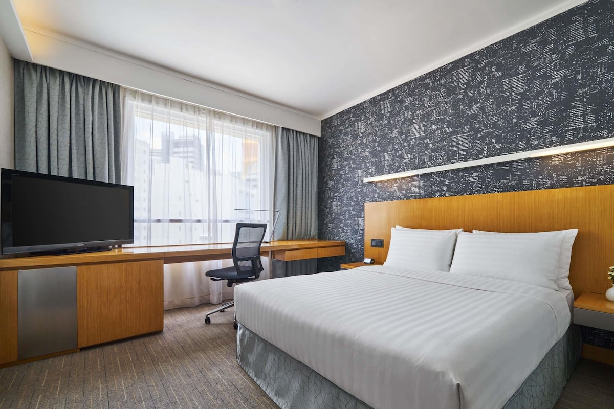 1 sovrum, duntäcken, minibar och värdeförvaringsskåp på rummet
