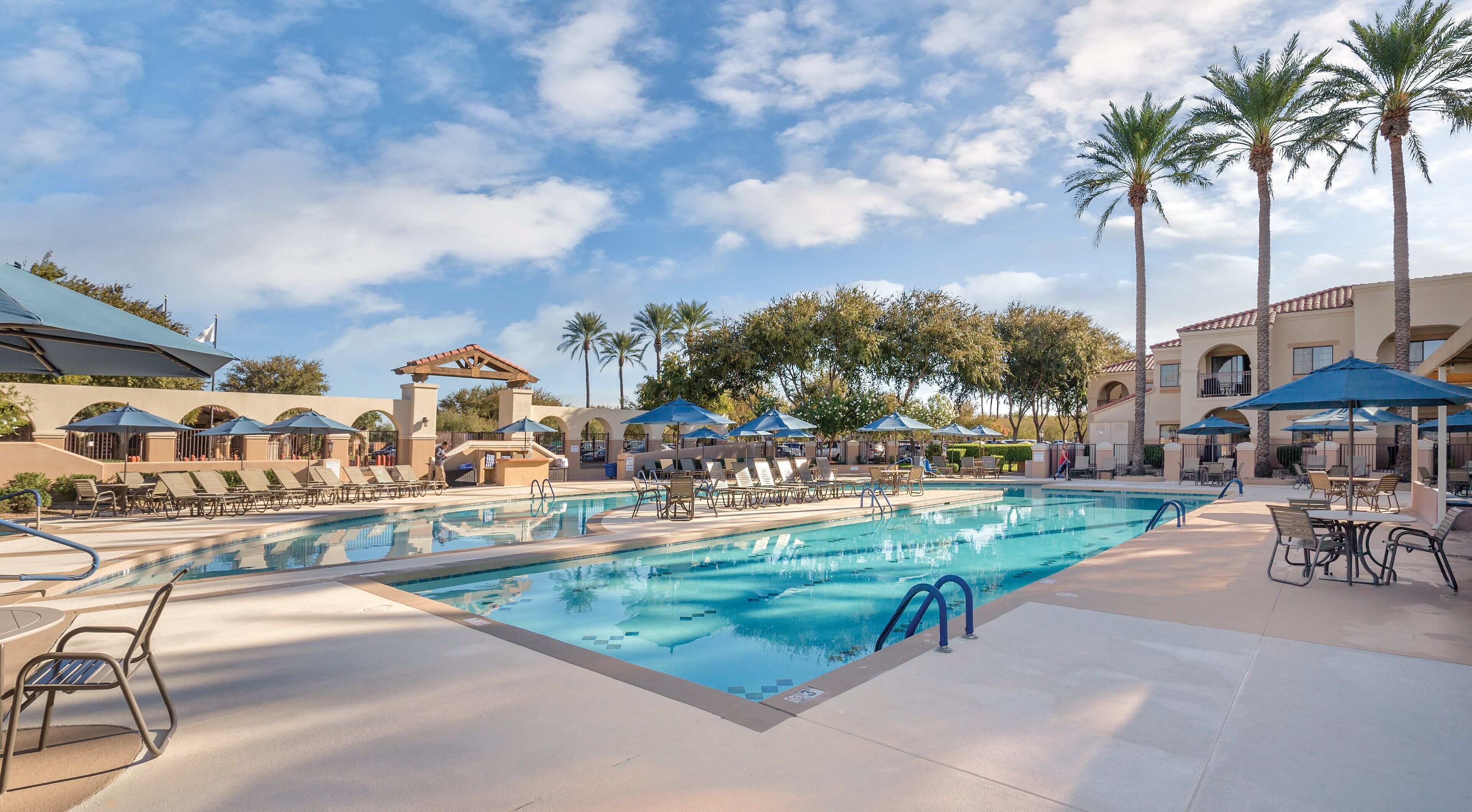 outdoor pool, open 7 am to 10 pm, pool umbrellas, pool loungers