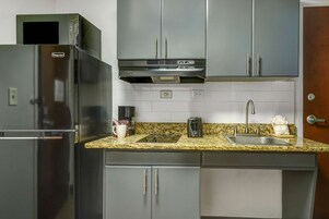 Fridge, microwave, stovetop, coffee/tea maker