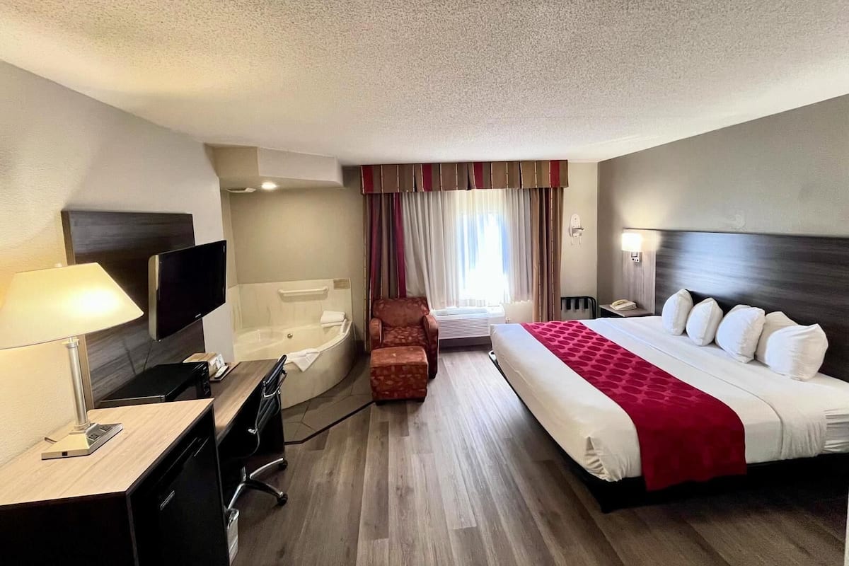 Studio Suite, 1 King Bed, Non Smoking | 1 bedroom, desk, blackout drapes, iron/ironing board