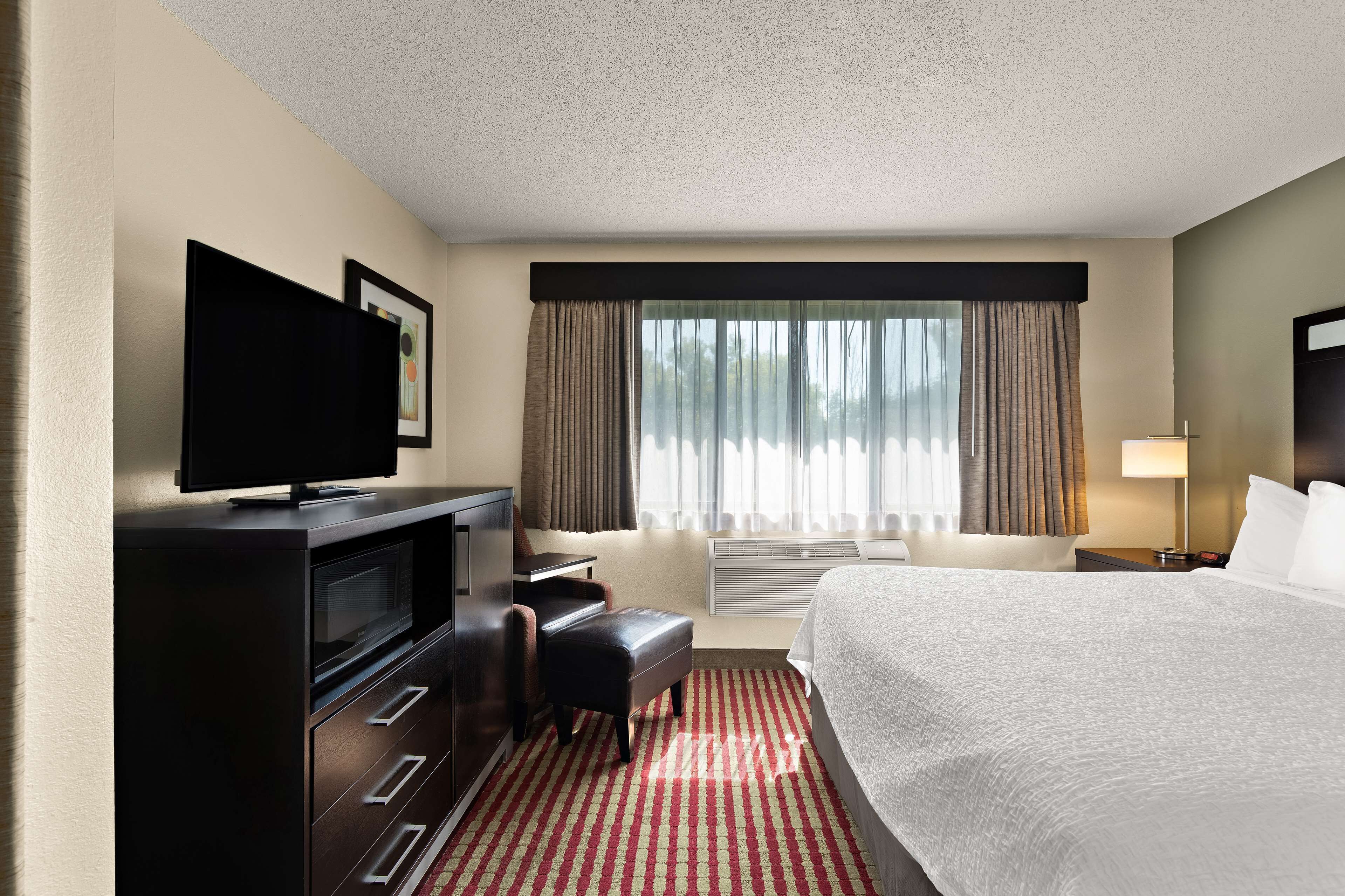 suite, 1 king bed, non smoking, refrigerator & microwave (with sofabed) | desk, iron/ironing board, wifi, bed sheets