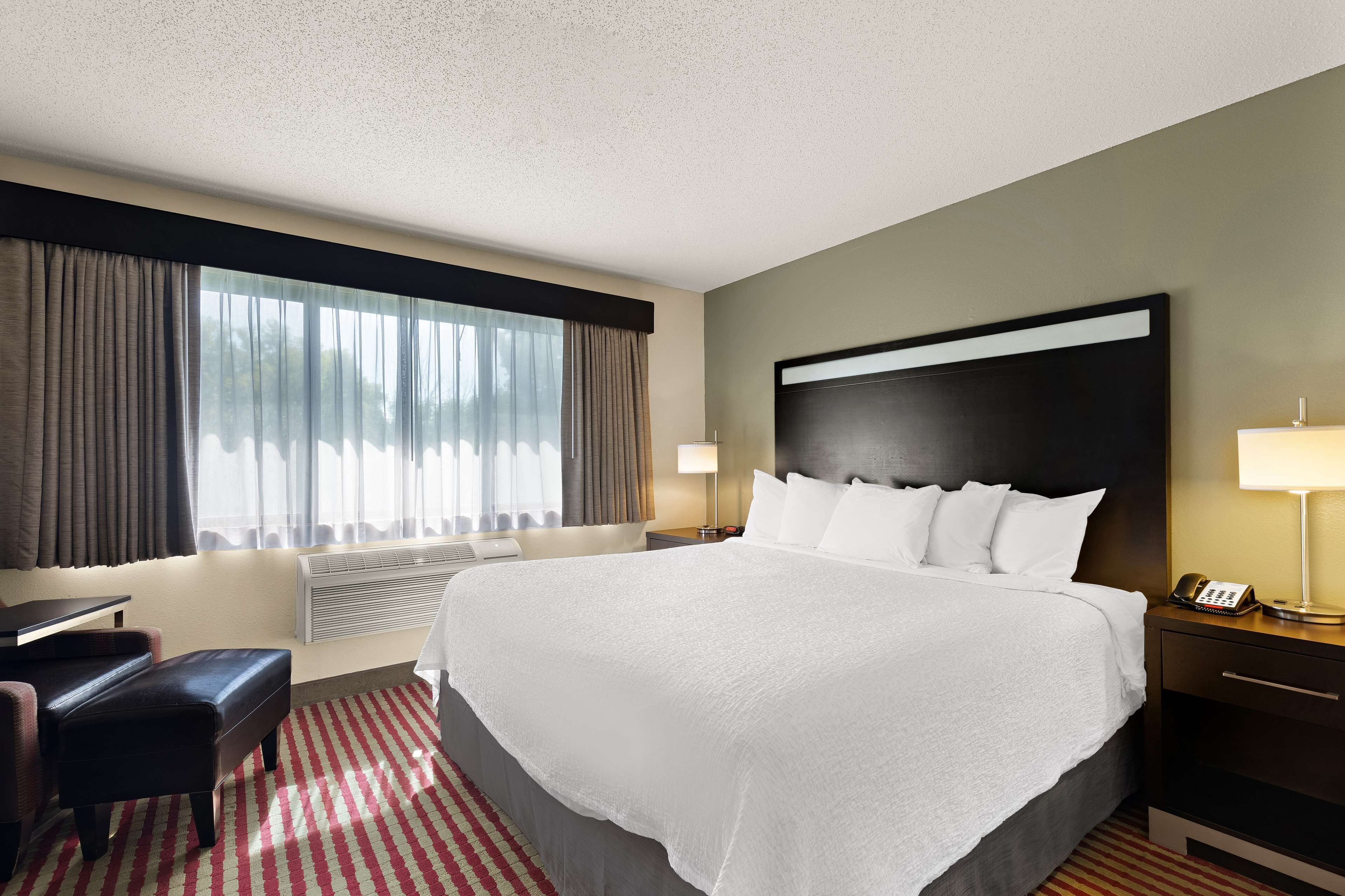 suite, 1 king bed, non smoking, refrigerator & microwave (with sofabed) | desk, iron/ironing board, wifi, bed sheets