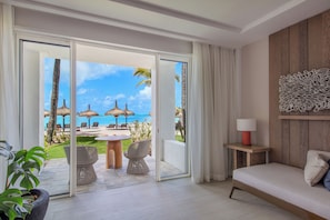 Hibiscus Signature Beachfront Suite | Living area | 55-inch LCD TV with satellite channels, TV, table tennis