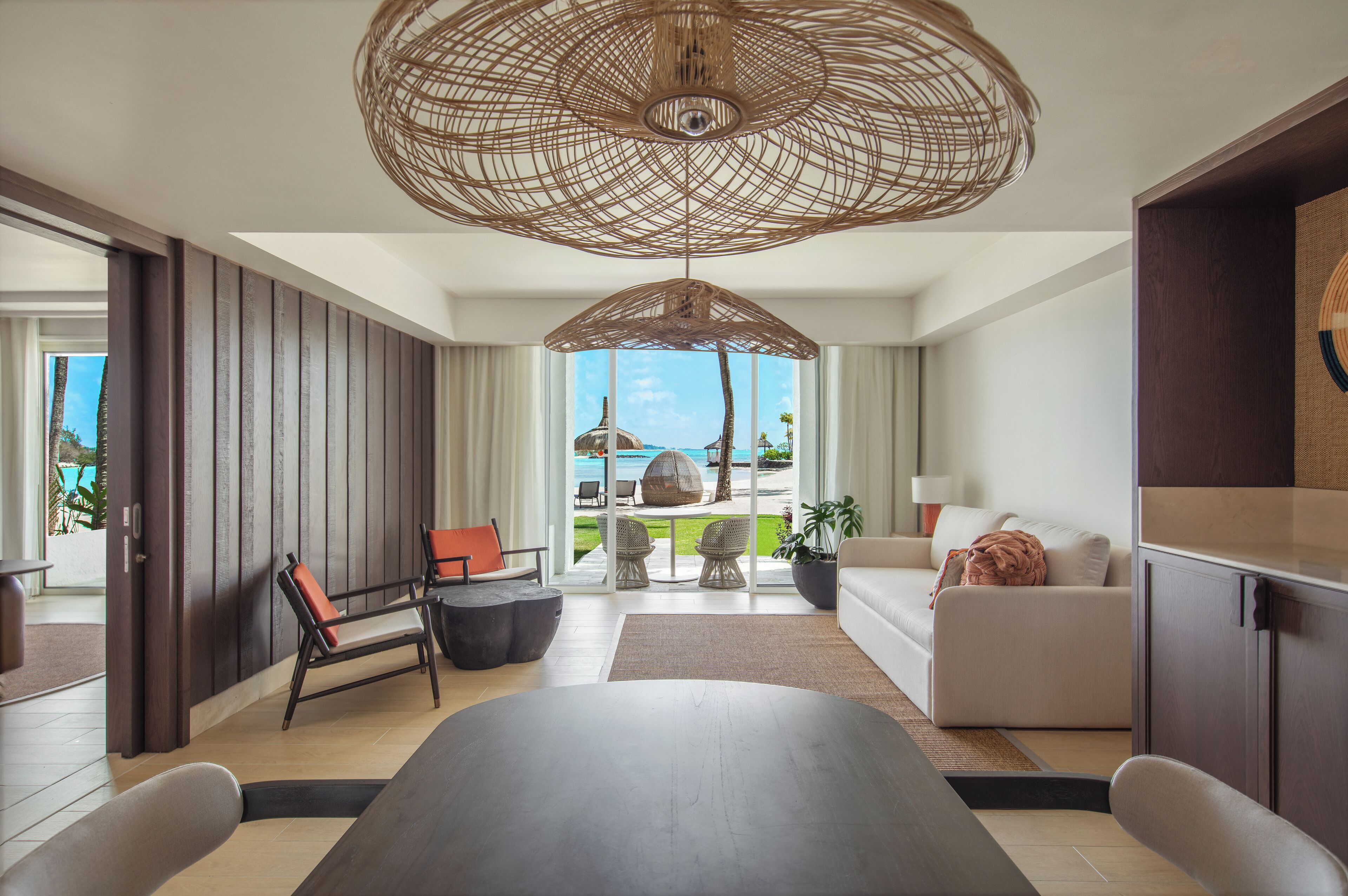 hibiscus signature beachfront suite | living area | 55-inch lcd tv with satellite channels, tv, ping pong