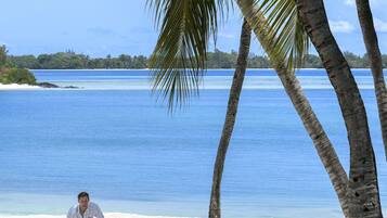 Private beach, white sand, free beach shuttle, beach cabanas