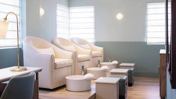 Relax in a stylish seating area with cushioned chairs and stools.