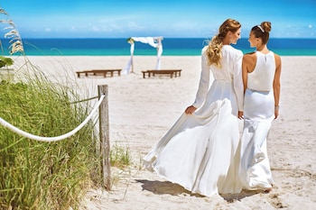 On the beach, white sand, beach cabanas, sun loungers at Marriott Stanton South Beach