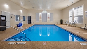 An indoor swimming pool with clear lane markings, a lifeguard chair, and a no diving sign. - Best Western Crown Inn & Suites (Batavia)