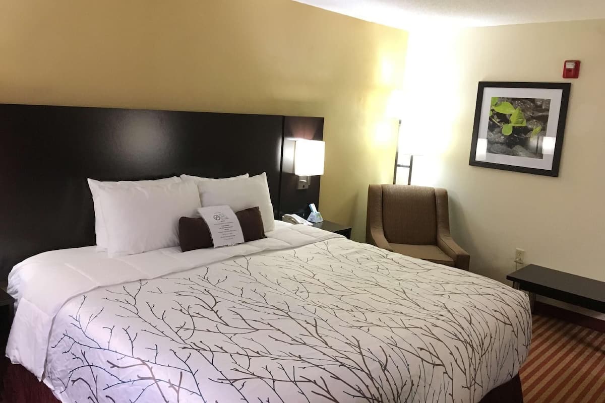 Premium bedding, desk, laptop workspace, iron/ironing board