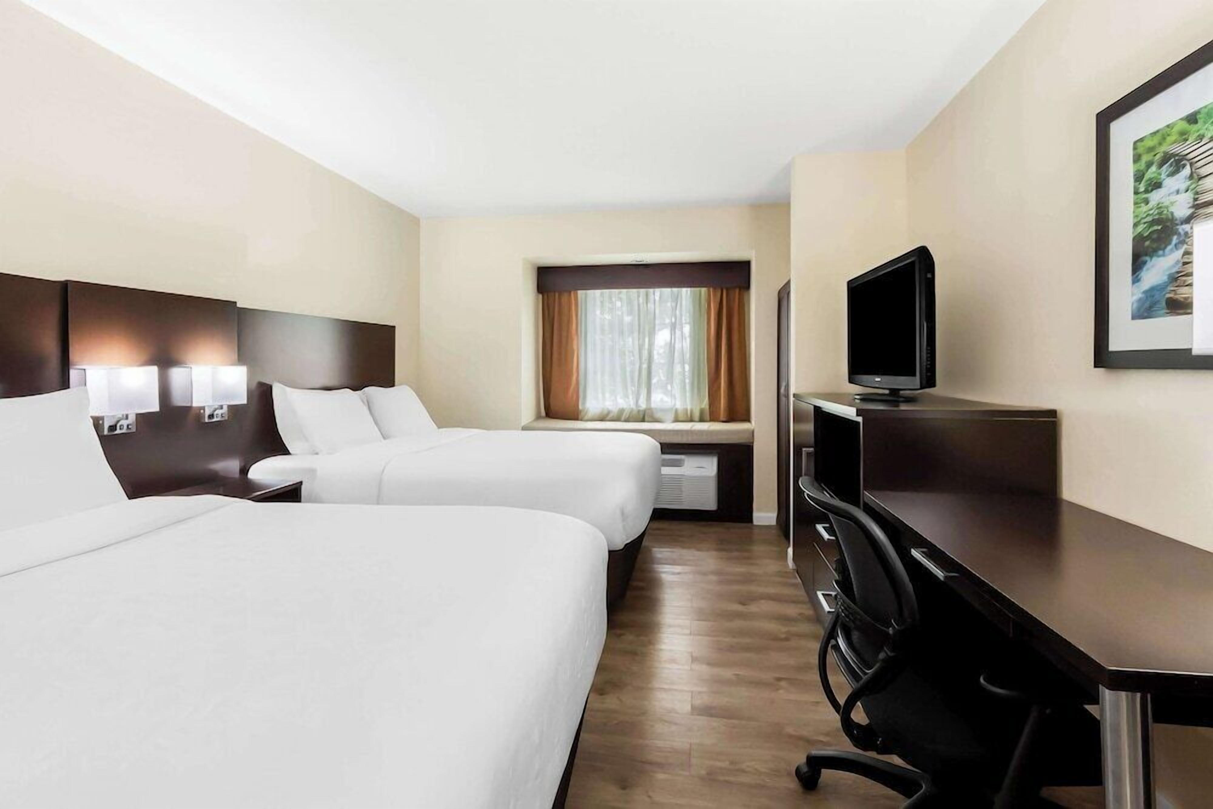 Premium bedding, desk, laptop workspace, iron/ironing board