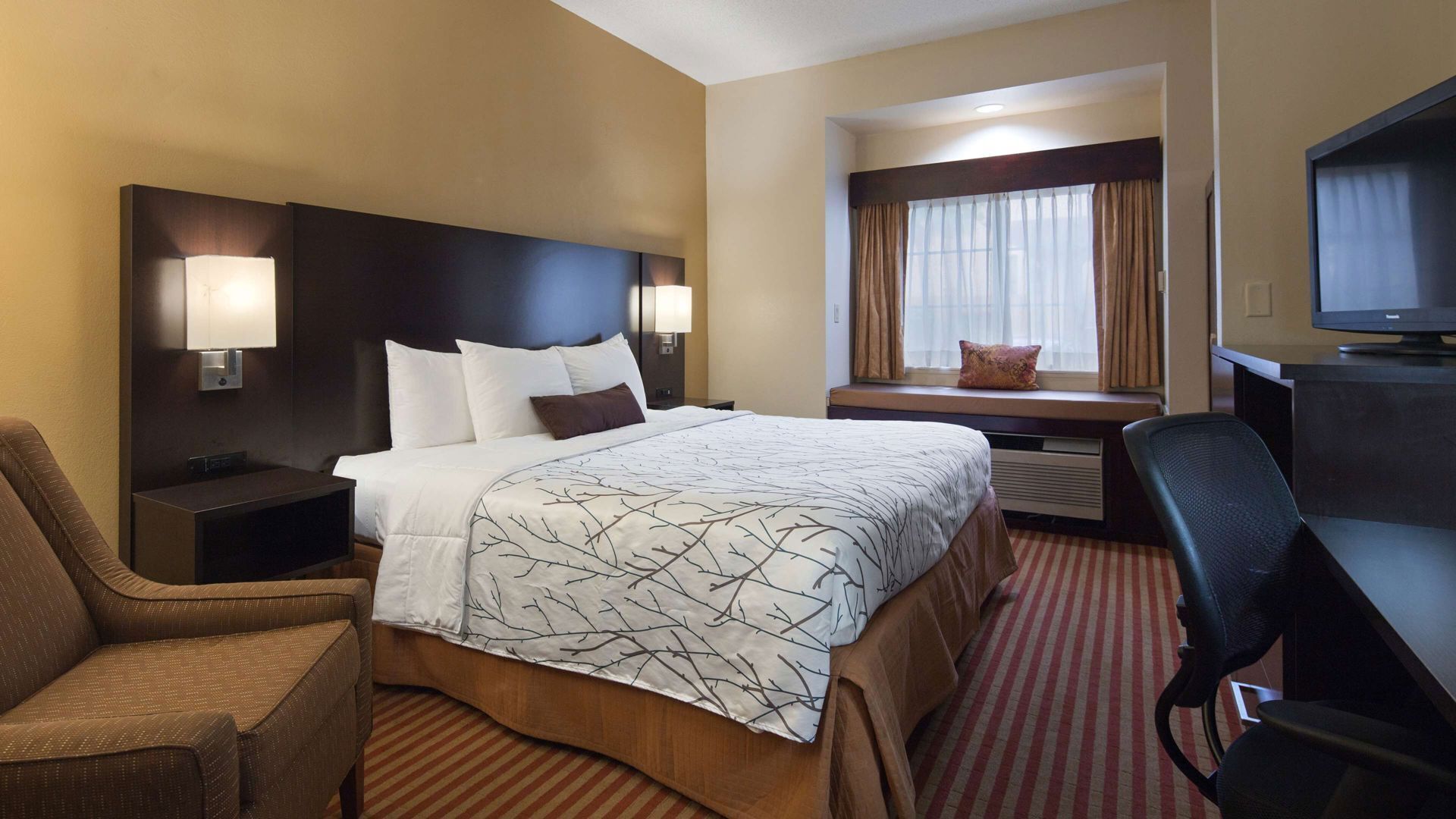 Premium bedding, desk, laptop workspace, iron/ironing board