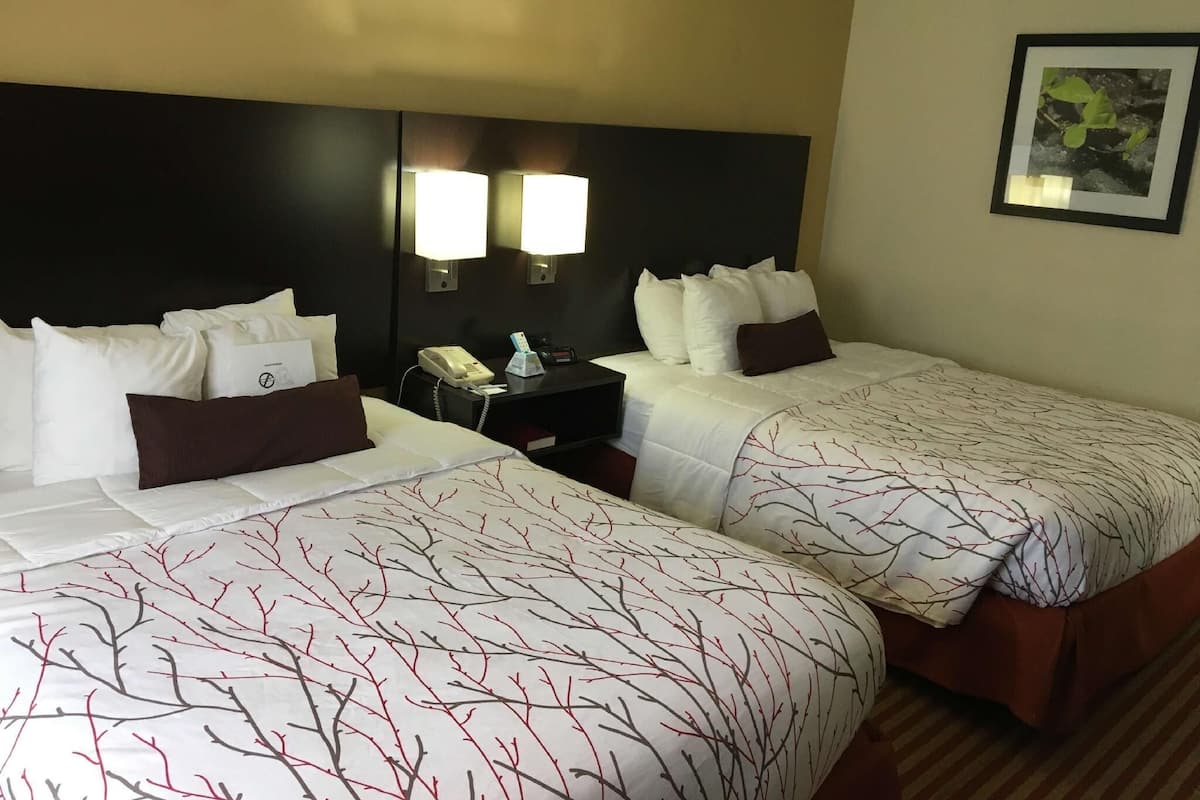 Premium bedding, desk, laptop workspace, iron/ironing board