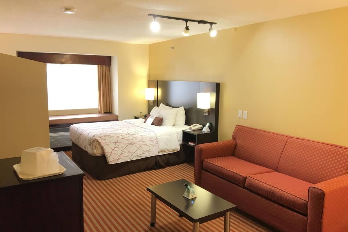 Premium bedding, desk, laptop workspace, iron/ironing board