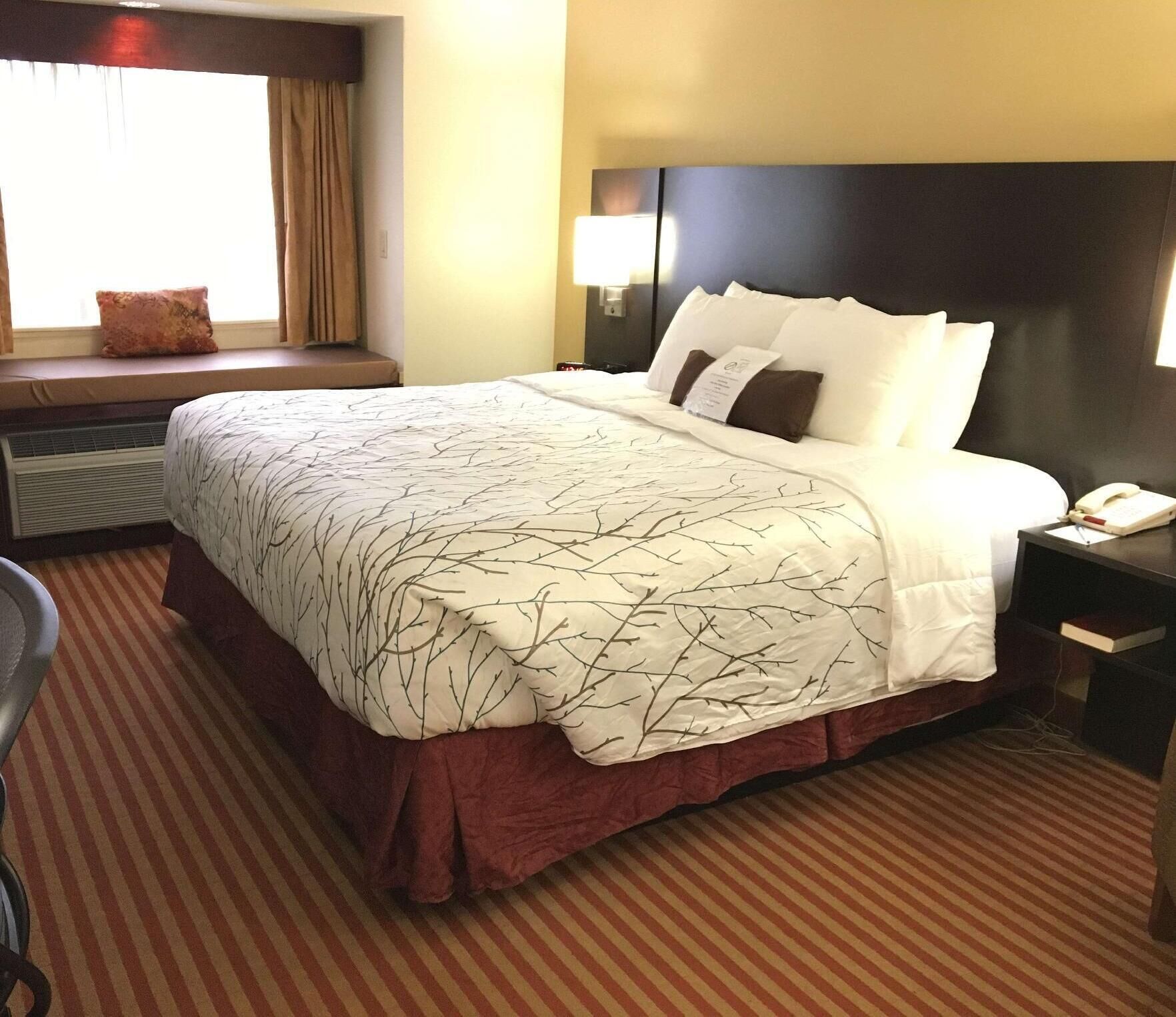 Premium bedding, desk, laptop workspace, iron/ironing board