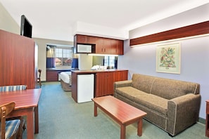 Desk, laptop workspace, blackout drapes, iron/ironing board