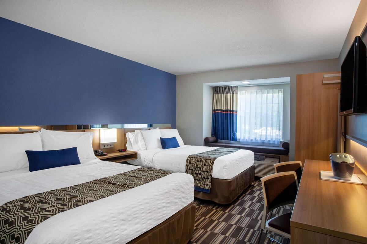 In-room safe, desk, iron/ironing board, cribs (free)