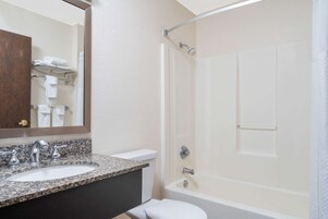 Designer toiletries, hair dryer, towels
