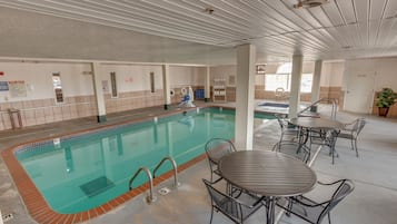 Relax by the pool surrounded by a spacious deck and comfortable seating areas.