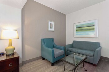 Individually furnished, desk, blackout drapes, iron/ironing board at Baymont by Wyndham Orlando/International Dr/Universal Blvd