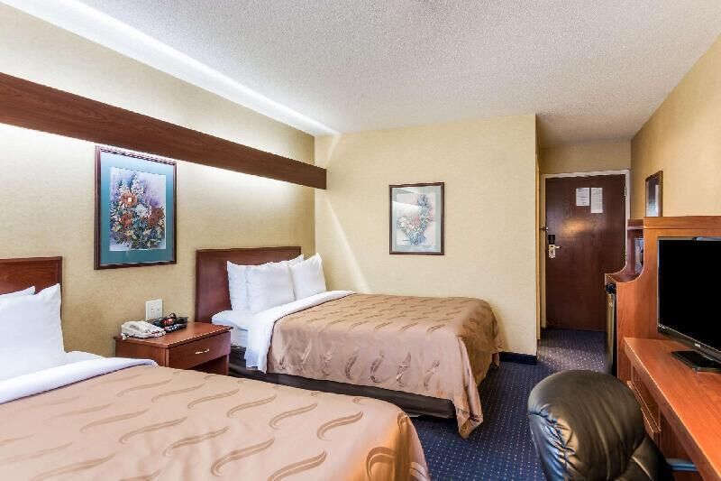 Premium bedding, desk, laptop workspace, soundproofing