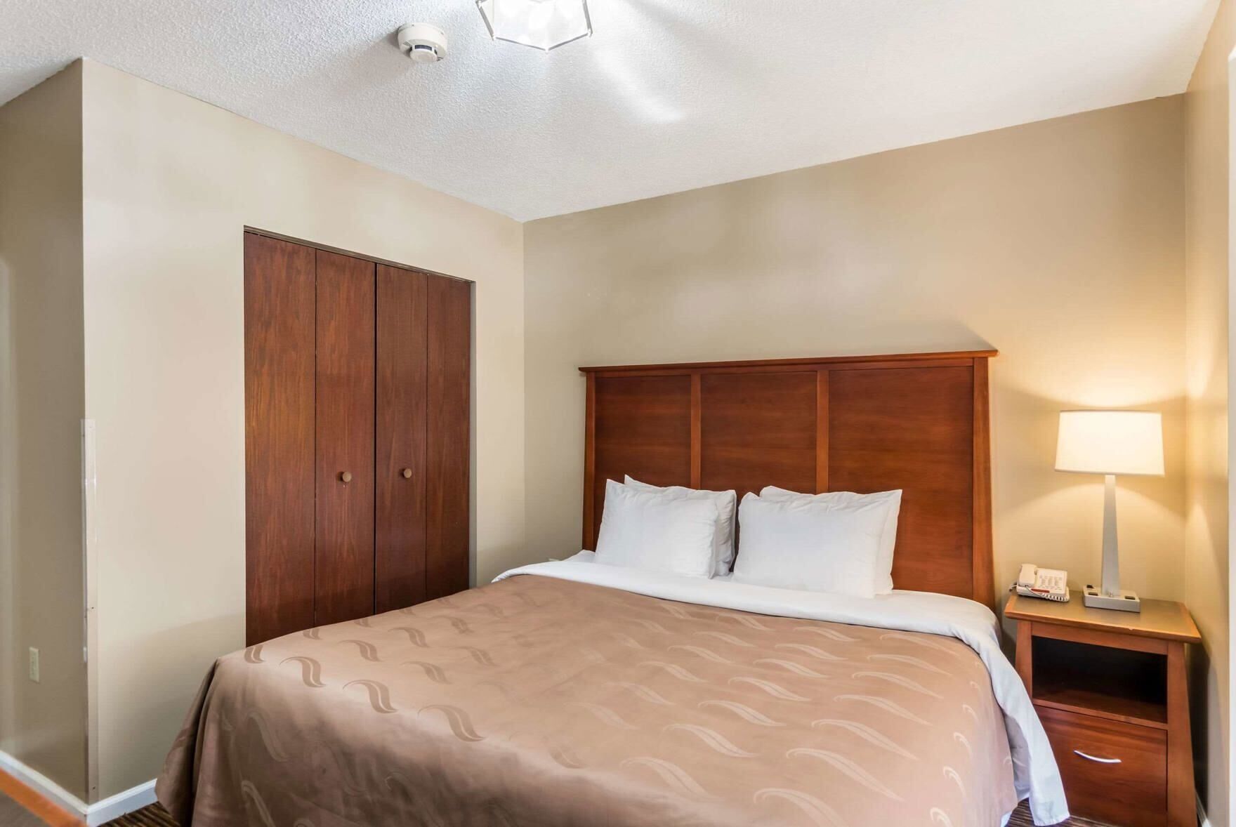 Premium bedding, desk, laptop workspace, soundproofing