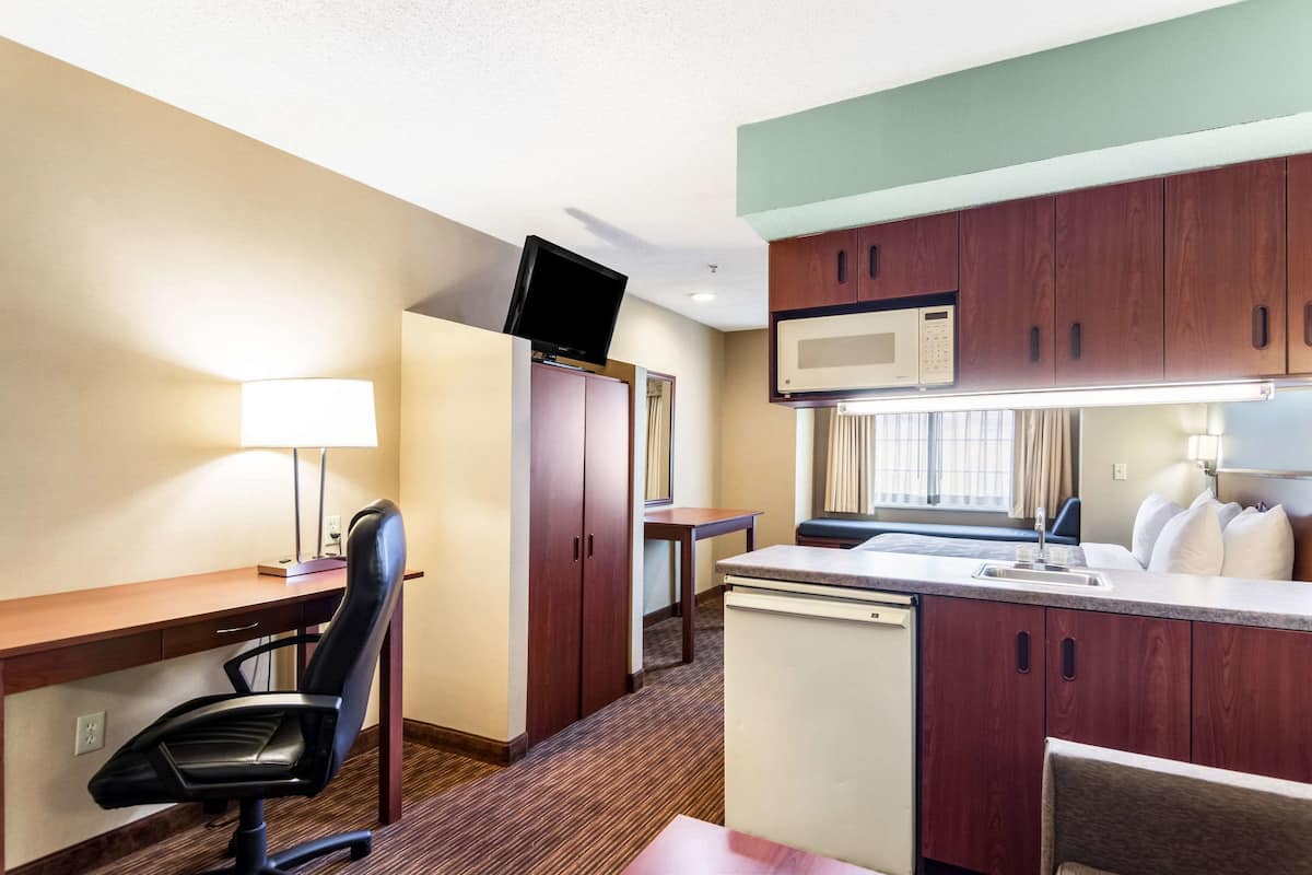 Premium bedding, desk, laptop workspace, soundproofing