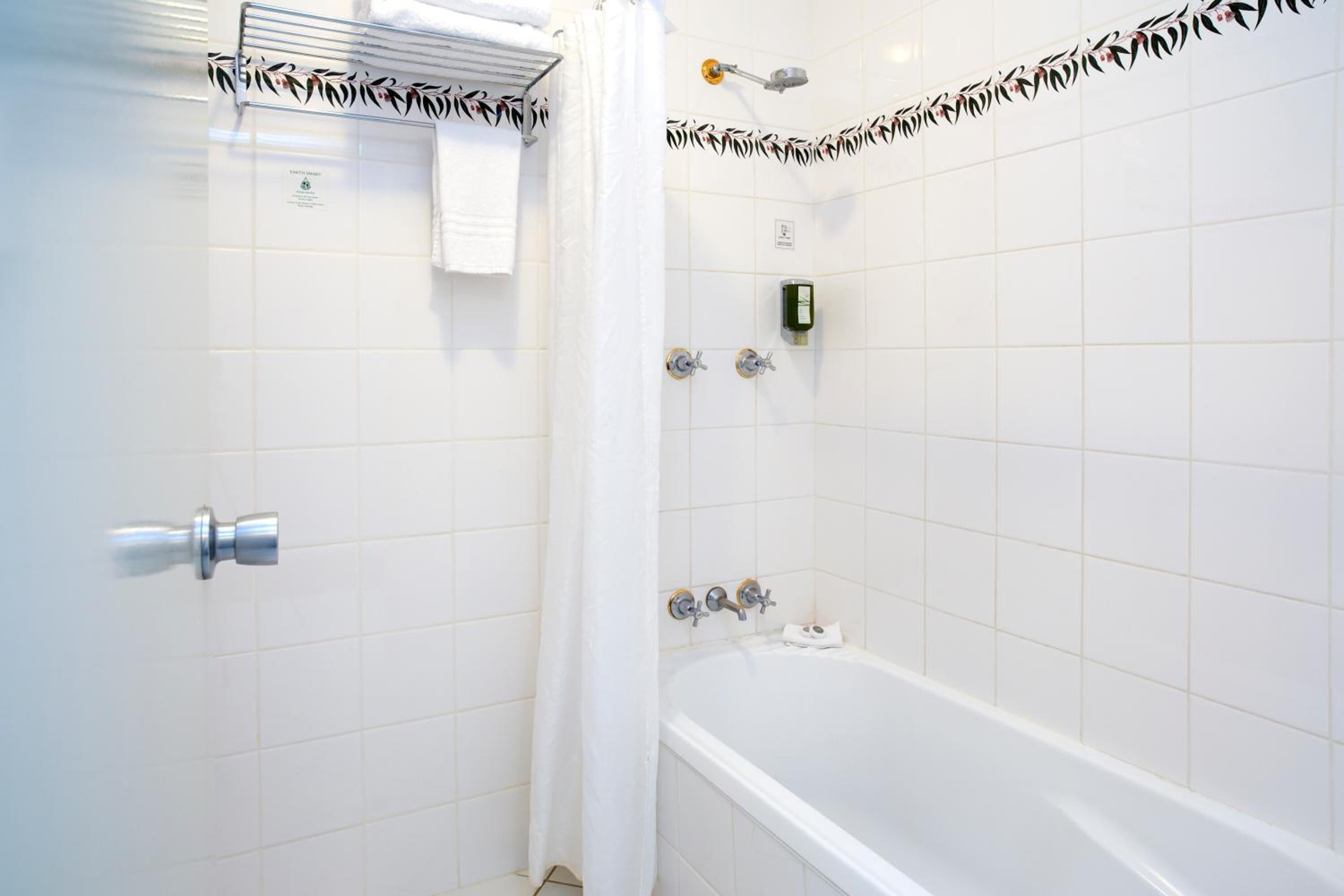 family room | bathroom | combined shower/bathtub, hair dryer, towels