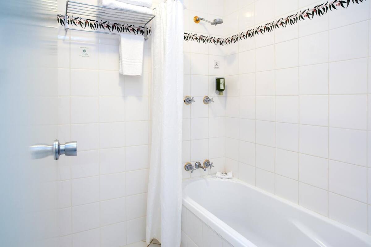 family room | bathroom | combined shower/bathtub, hair dryer, towels