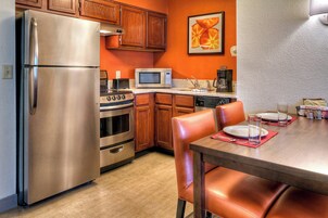 Full-size fridge, microwave, stovetop, coffee/tea maker