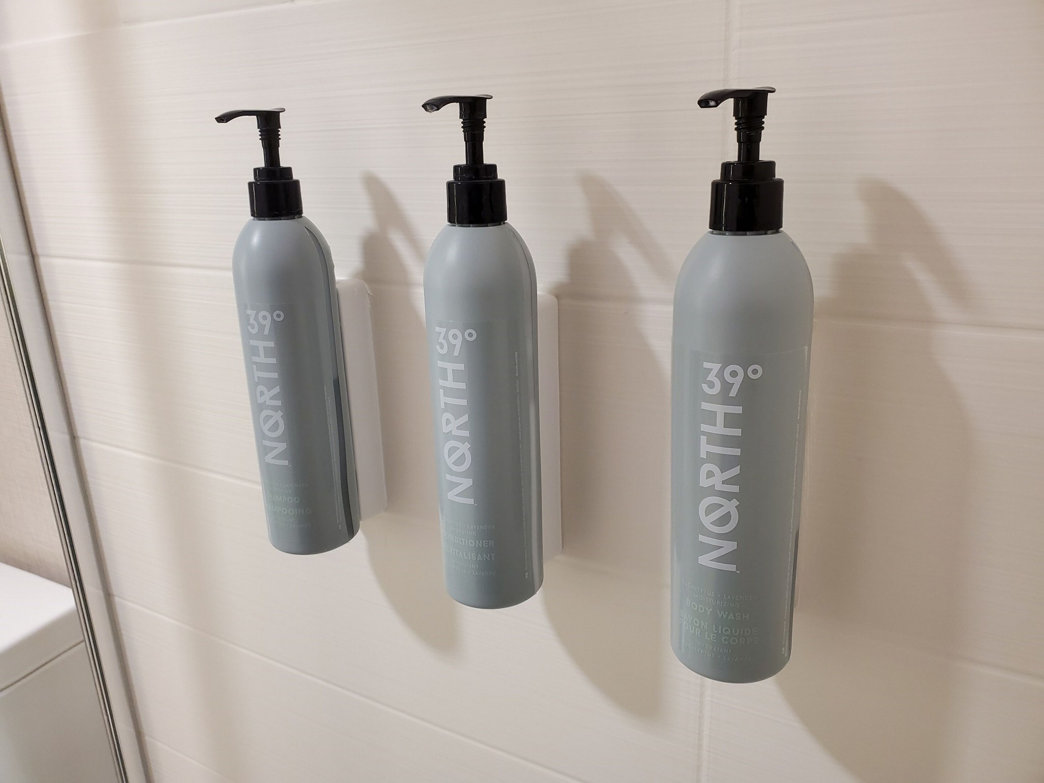 designer toiletries, hair dryer, towels