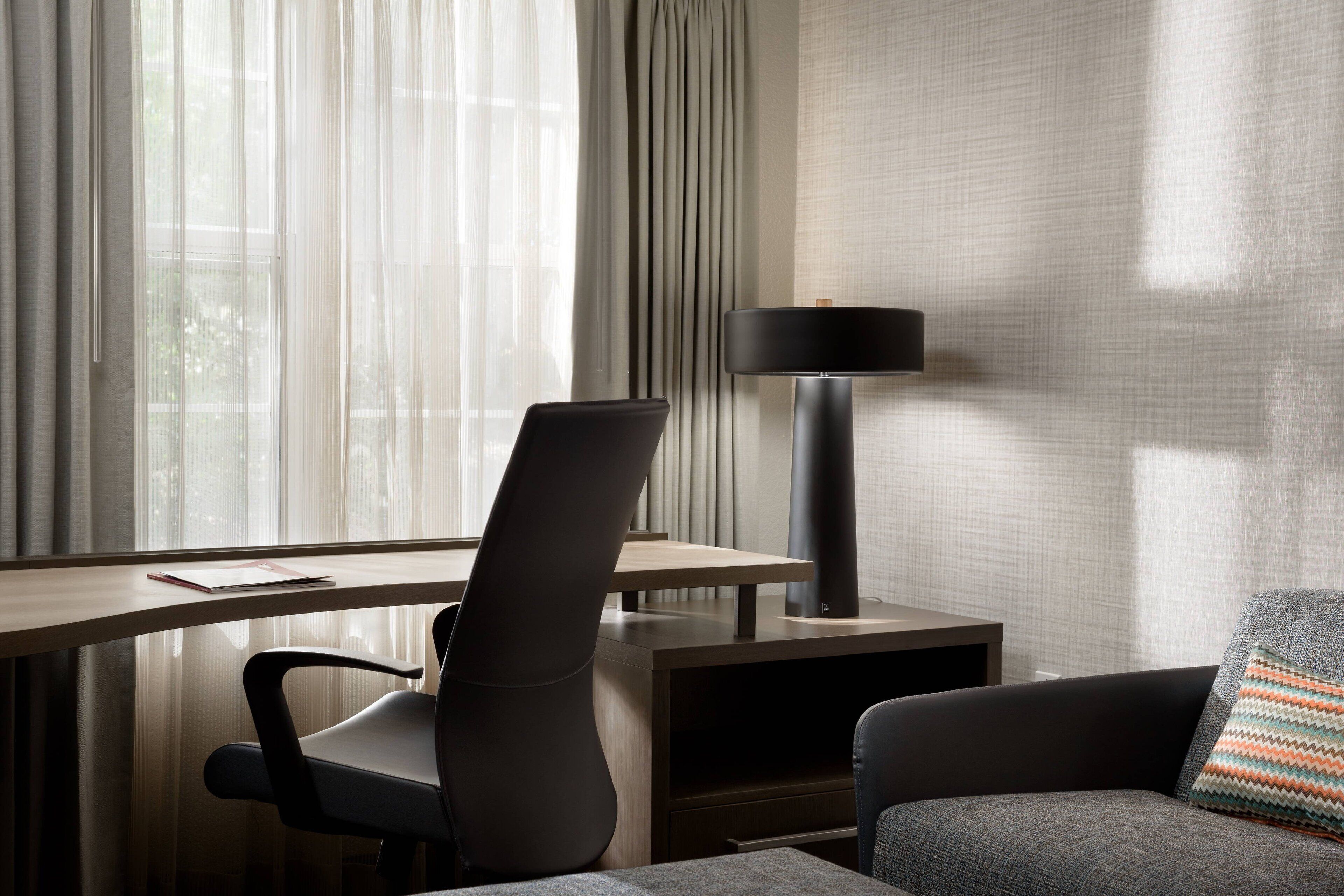 premium bedding, pillow-top beds, desk, laptop workspace