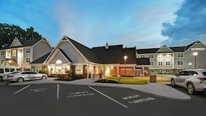 A hotel with guest parking, a well-lit entrance, and a brick facade. - Residence Inn by Marriott Louisville Airport (Louisville)