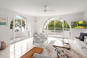 3 Bedroom Beach Front Apartment | Living room | 50-inch Smart TV with digital channels, TV, Netflix