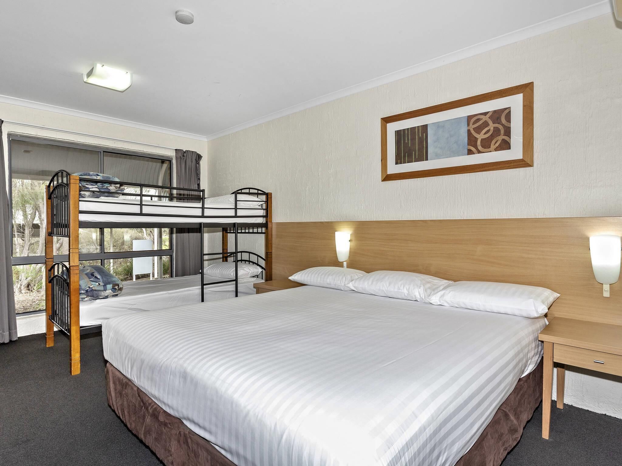 Standard Room (1 King Bed and 1 Bunk Bed) | Blackout drapes, free cribs/infant beds, free WiFi, bed sheets