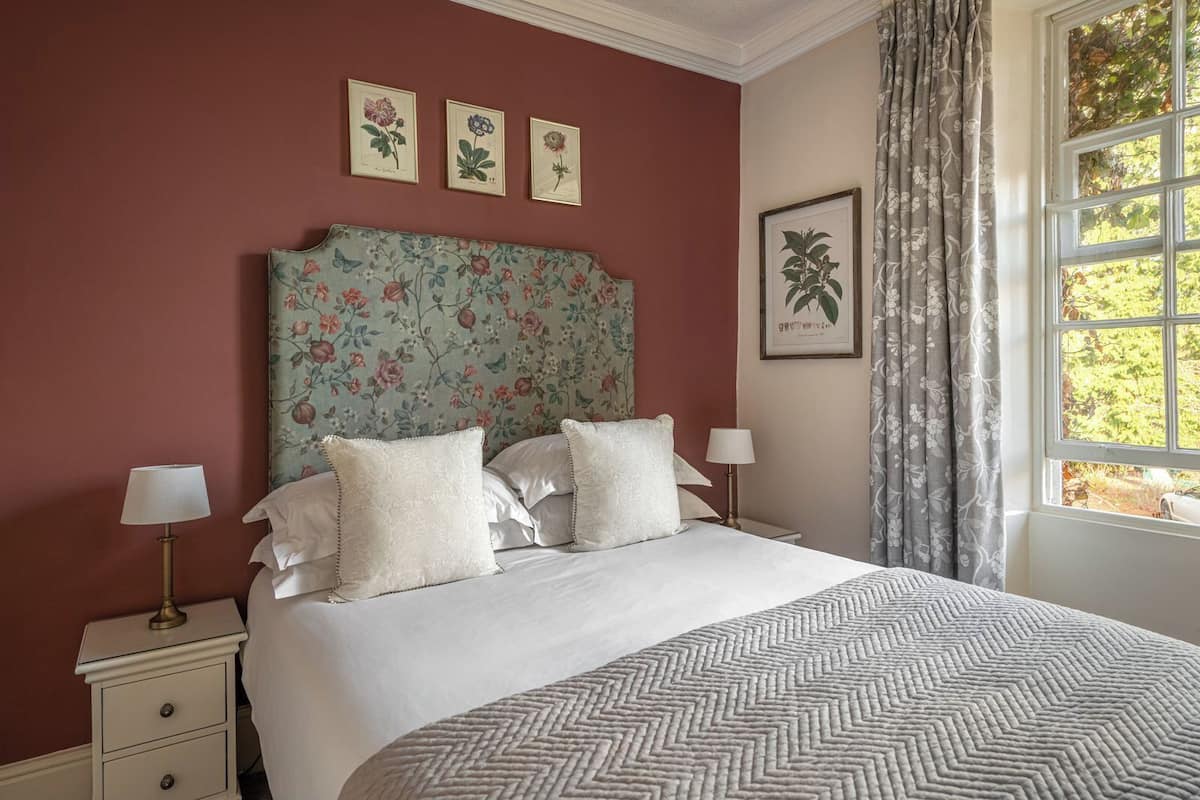 Desk, iron/ironing board, bed sheets