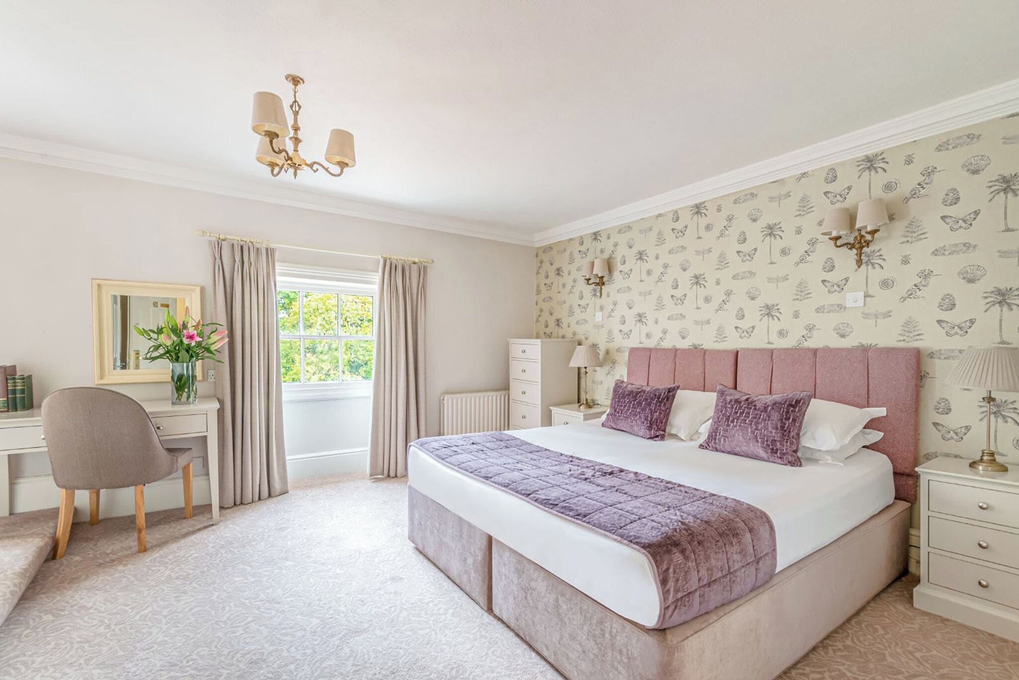 Desk, iron/ironing board, bed sheets