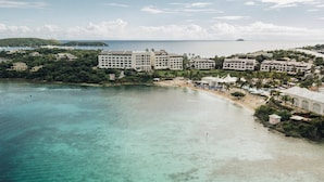 A resort with multiple buildings, a beach, and clear turquoise waters. - The Ritz-Carlton, St. Thomas (St. Thomas)